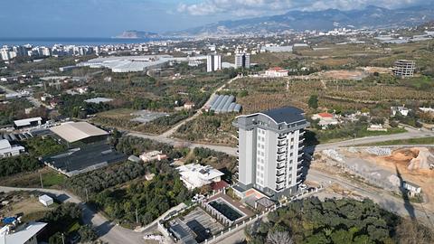 Апартаменти з 1-2 спальнями на продаж у Махмутларі Алання з басейном